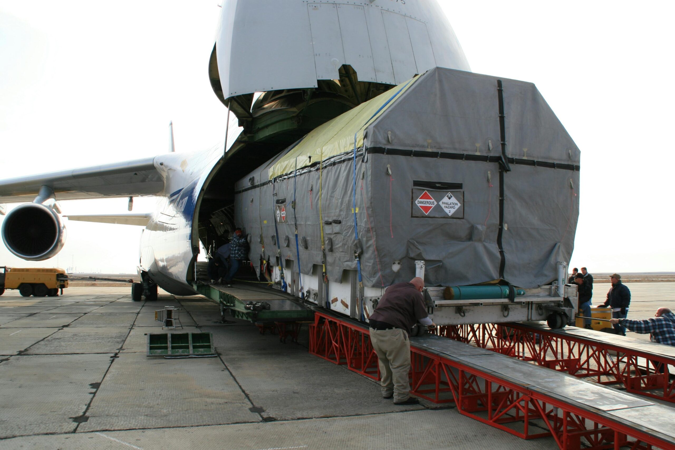 A massive cargo is loaded onto an Antonov aircraft at Baikonur, Kazakhstan.